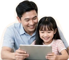 An Asian father and daughter exploring a tablet together
